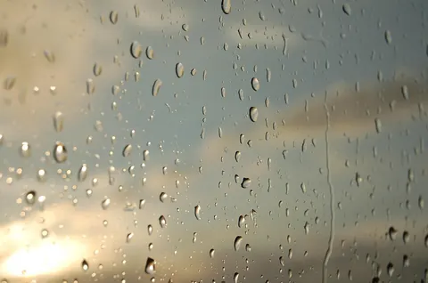 A close, monochrome view of a hazy, fogged glass surface