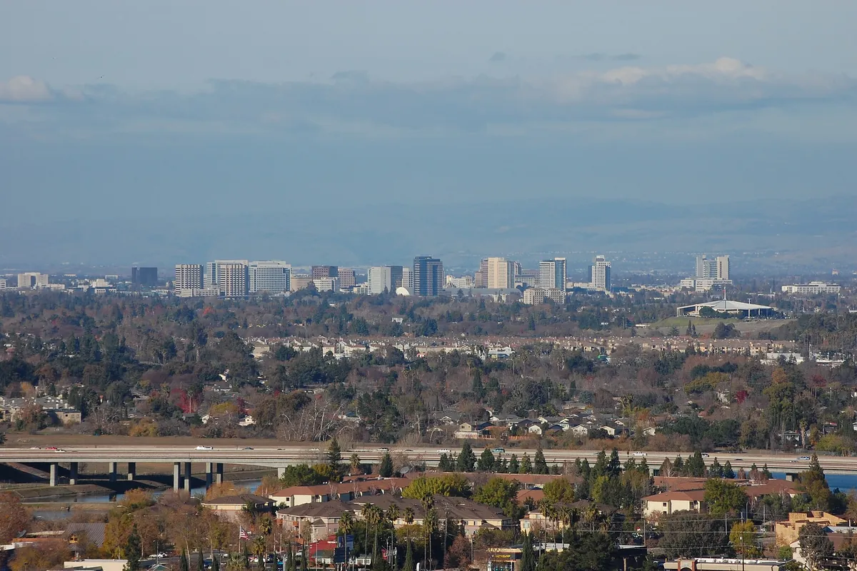 Downtown San Jose's towers on the horizon, seen across the South Bay suburbs