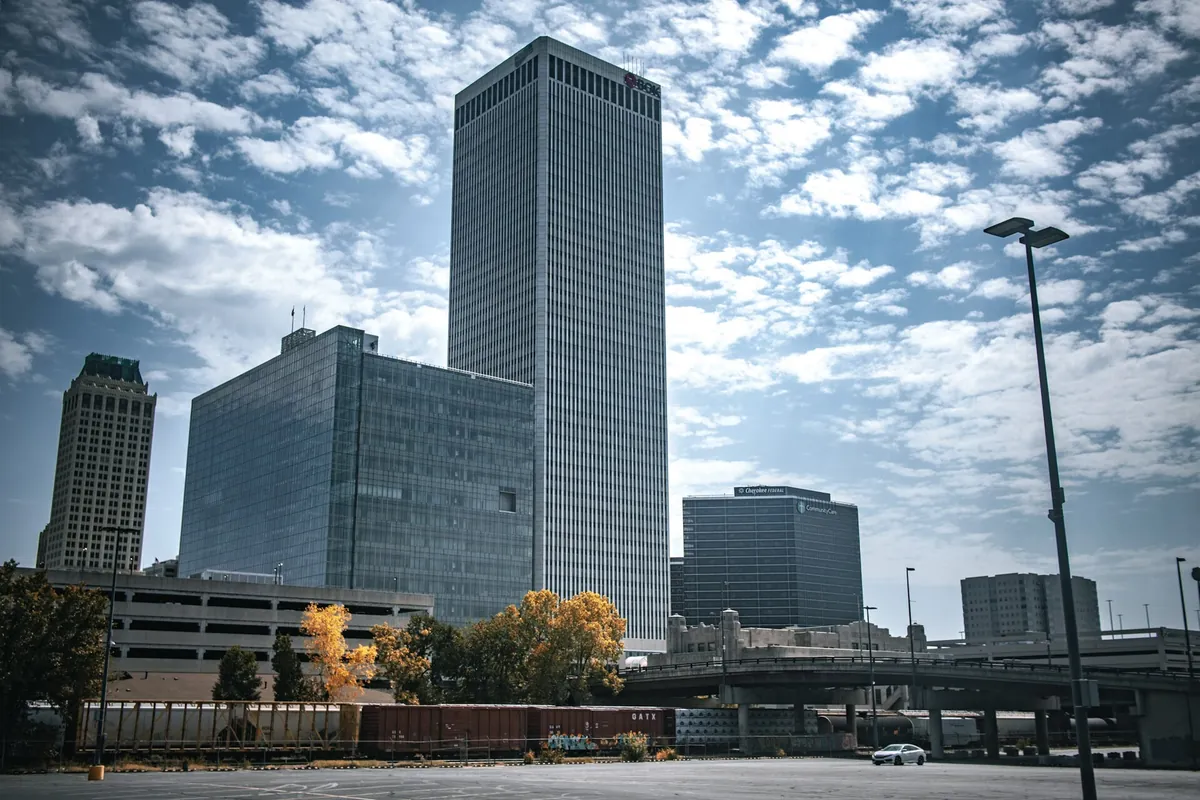 The BOK Tower and neighbouring office buildings in downtown Tulsa under a streaked sky