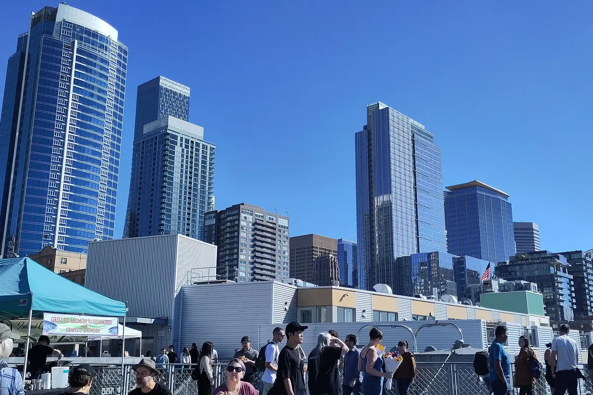 Glass residential and office towers along Seattle's downtown waterfront on a sunny day