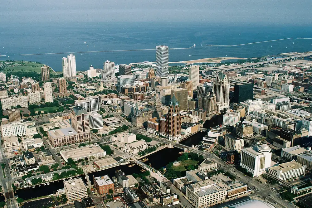 Downtown Milwaukee's towers and the Lake Michigan shore seen from the air