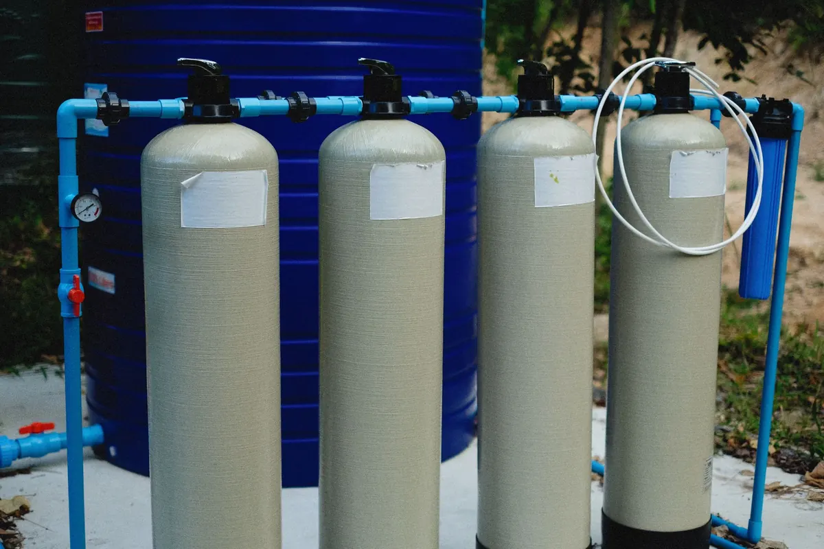 A row of water-treatment filter vessels plumbed together
