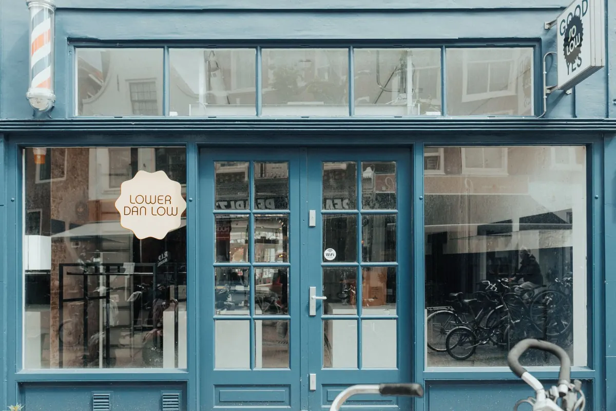A shop front with a glazed door and display windows
